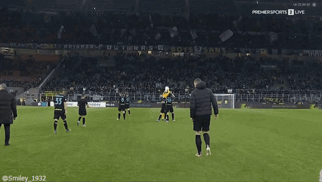 a group of soccer players are on a field with an ad for snailpay