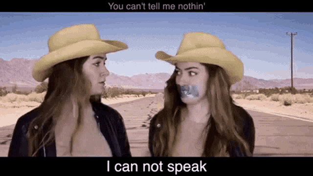 two women wearing cowboy hats with tape on their mouths and the words " i can not speak " below them
