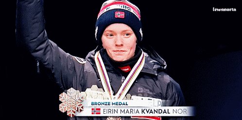 a woman wearing a medal that says eirin maria k vandal nor