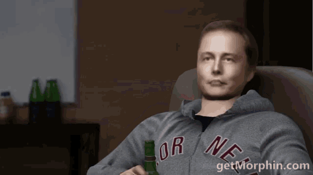 a man sitting in a chair with a bottle of beer and a hoodie that says or ne on it