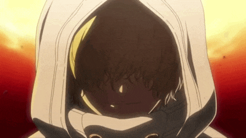 a close up of a person wearing a white hoodie with a hood over their head .