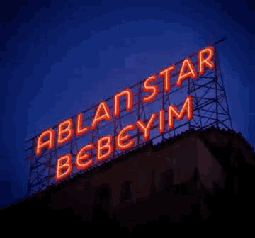 a neon sign that says ablan star bebeyim on it