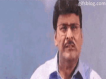 a man with glasses and a mustache says " ada cheiii "