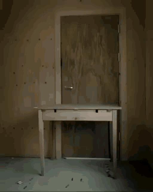 a white table in a room with a door open