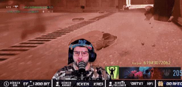 a man wearing headphones and glasses is playing a video game on a computer screen