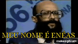 a bald man with glasses and a beard says meu nome e eneas .