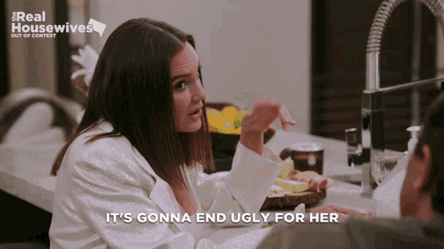 a woman says it 's gonna end ugly for her in front of a sink