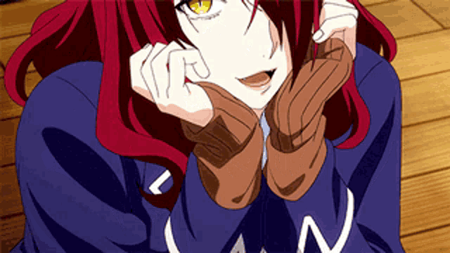 a girl with red hair is wearing a blue shirt that says n on it