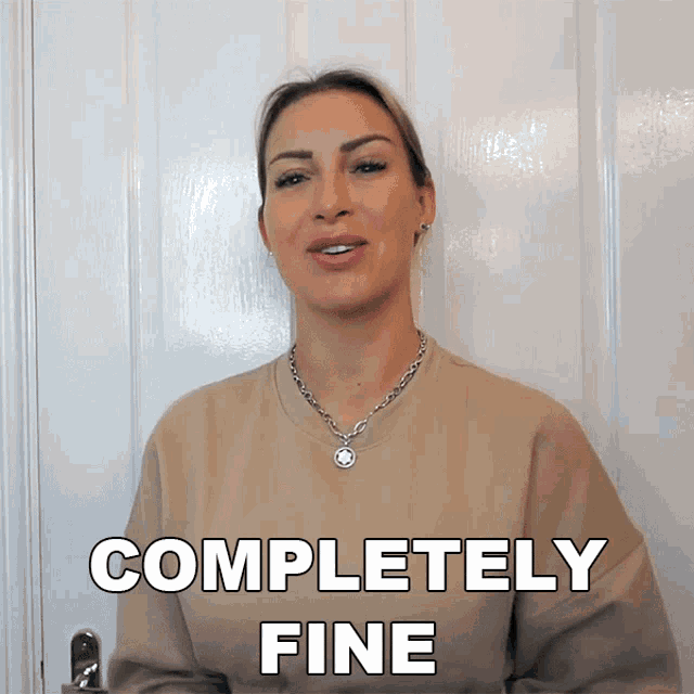 a woman in a tan sweater says completely fine in white letters