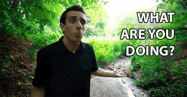 a man standing on a dirt road with the words " what are you doing " on the bottom