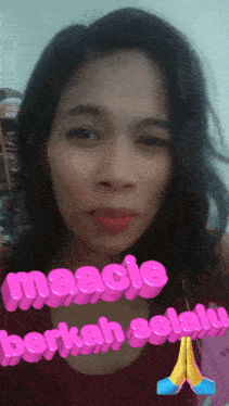 a woman 's face is shown with the words maacie berkah selay written in pink