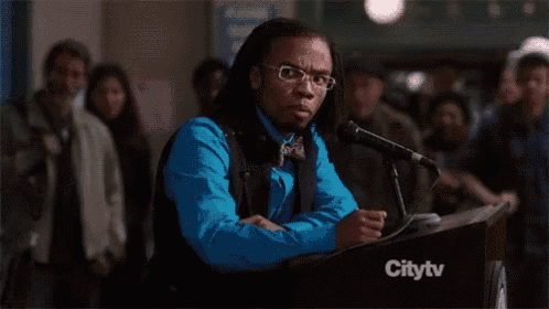 a man is giving a speech at a podium with citytv written on it