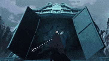 a man in a black cloak is standing in front of a large door .