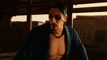 a man with a bandage on his eye is holding a sword in his hand