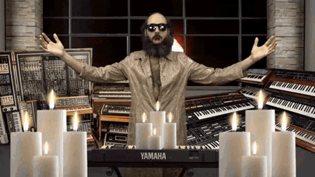a man stands in front of a yamaha keyboard