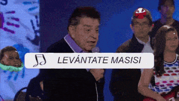 a man speaking into a microphone with a sign that says levantate masisi on it