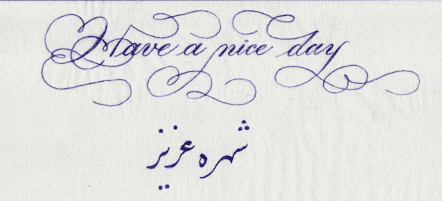 a piece of paper that says " have a nice day " in cursive
