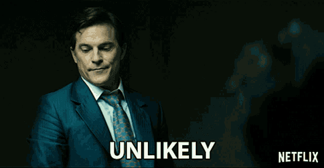 a man in a suit and tie is standing in front of a netflix logo