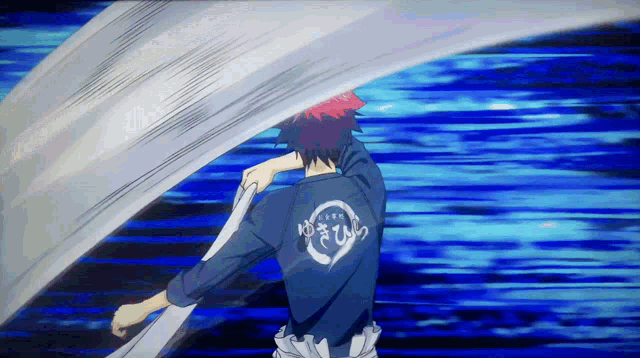 a man with a shirt that says ' yuki ' on the back