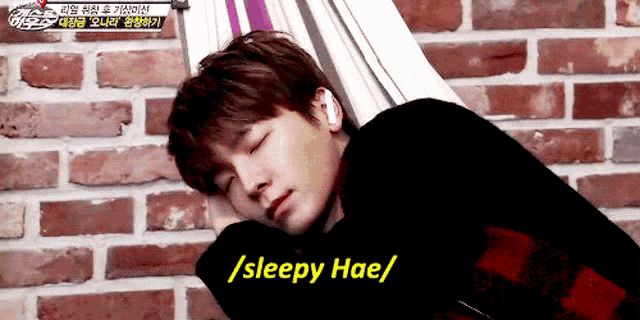 a young man is sleeping in a hammock with the words / sleepy hae / written next to him .