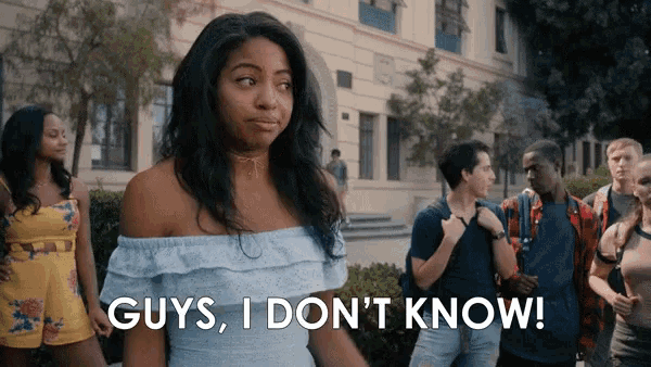 a woman is standing in front of a group of people and says guys i don t know