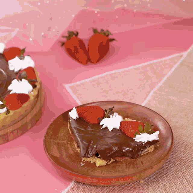 a piece of chocolate cake with whipped cream and strawberries on a wooden plate