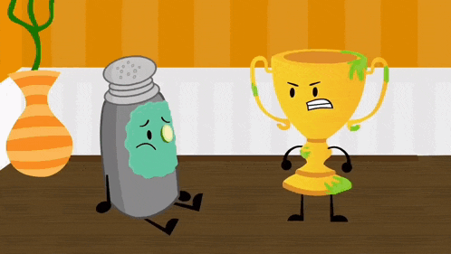 a salt shaker and a trophy are sitting on a wooden table .