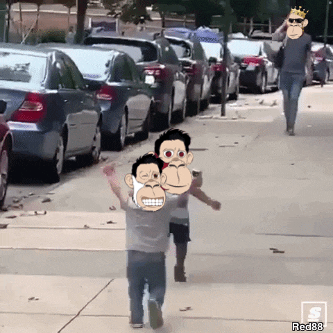 a man is walking down a street with two monkeys on his shoulder