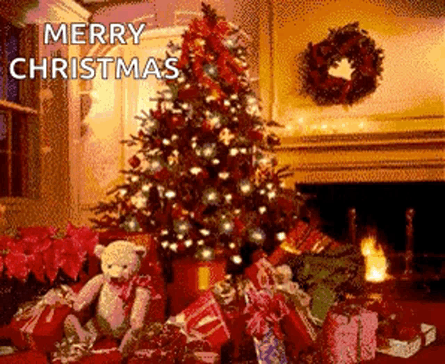 a christmas tree with gifts underneath it and the words merry christmas written above it