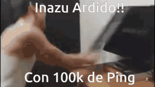 a man without a shirt is typing on a keyboard in front of a computer monitor with the caption inazu ardido