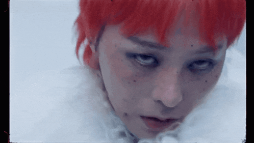 a close up of a person with red hair and freckles