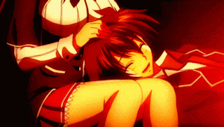 a girl is putting a bandage on a boy 's head in a dark room