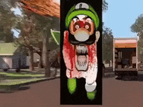 a picture of a cartoon character with blood on his face and a green hat .