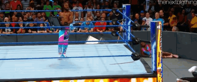 a wrestling ring with the nextbigthing written on the corner