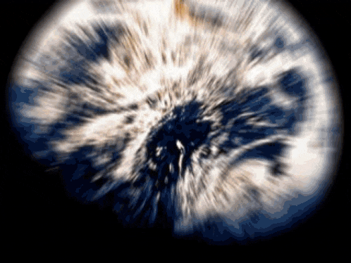 a blurred image of a globe with a black background