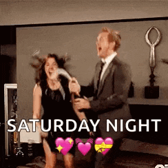 a man in a suit is holding a woman in a black dress while dancing in a room .