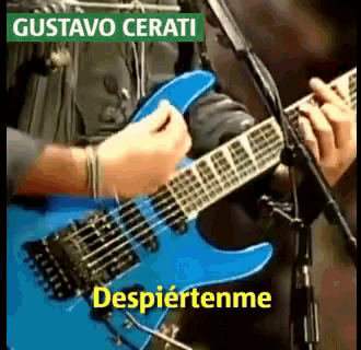a man playing a blue guitar with the name gustavo cerati written above him