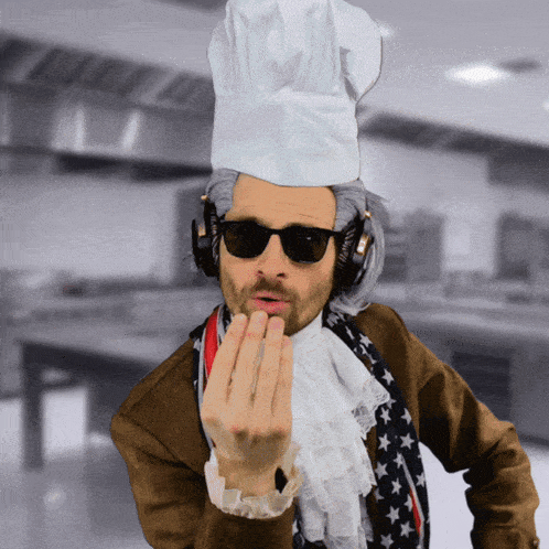 a man wearing a chef 's hat and sunglasses