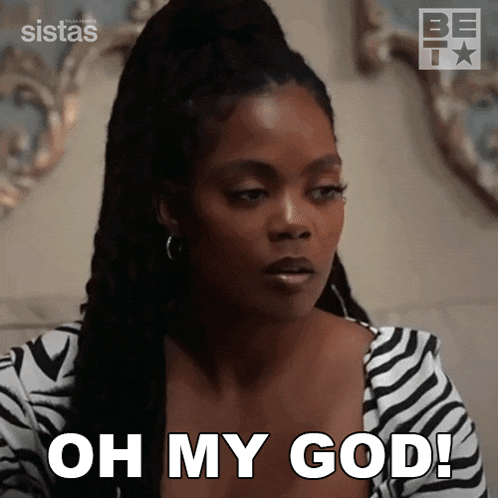 a woman in a zebra print shirt is saying oh my god .