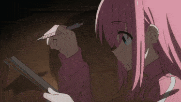 a girl with pink hair is writing on a piece of paper with a pencil
