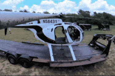 a helicopter with the numbers n58431 on the side of it