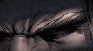 a close up of a person 's face with a very angry look on their face