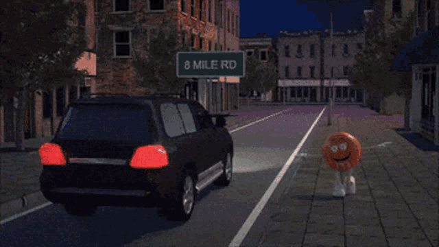 a car is driving down a street with a sign above it that says 8 mile rd