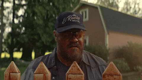 a man wearing a el rancho motel hat