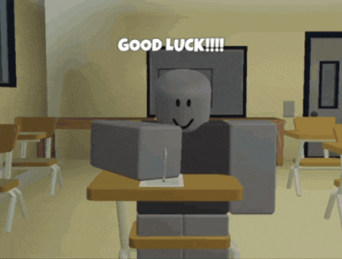 a roblox character sitting at a desk with the words good luck written above him