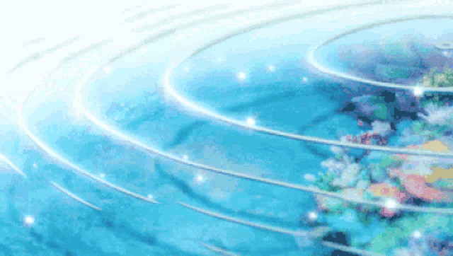 a circle of blue water with flowers in it