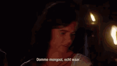 a woman in a dark room says " domme mongool "