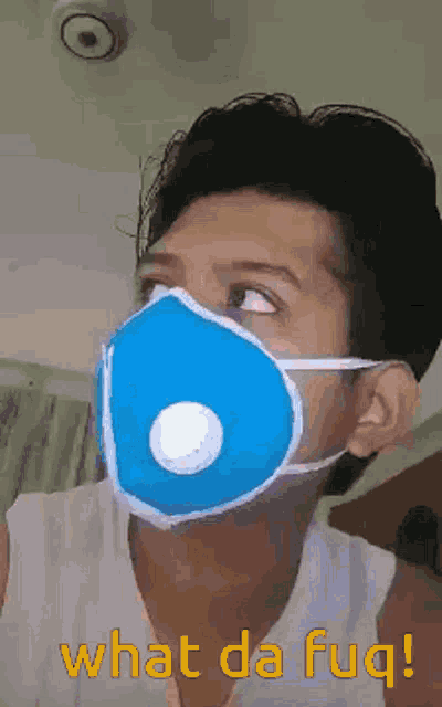 a man wearing a blue face mask says what da fug