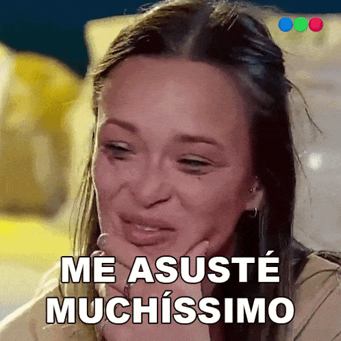 a woman is crying with the words me asuste muchissimo written above her