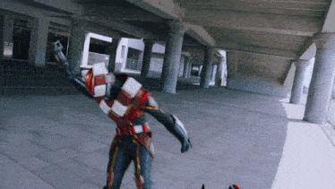 a man in a red and white striped costume is standing in a hallway
